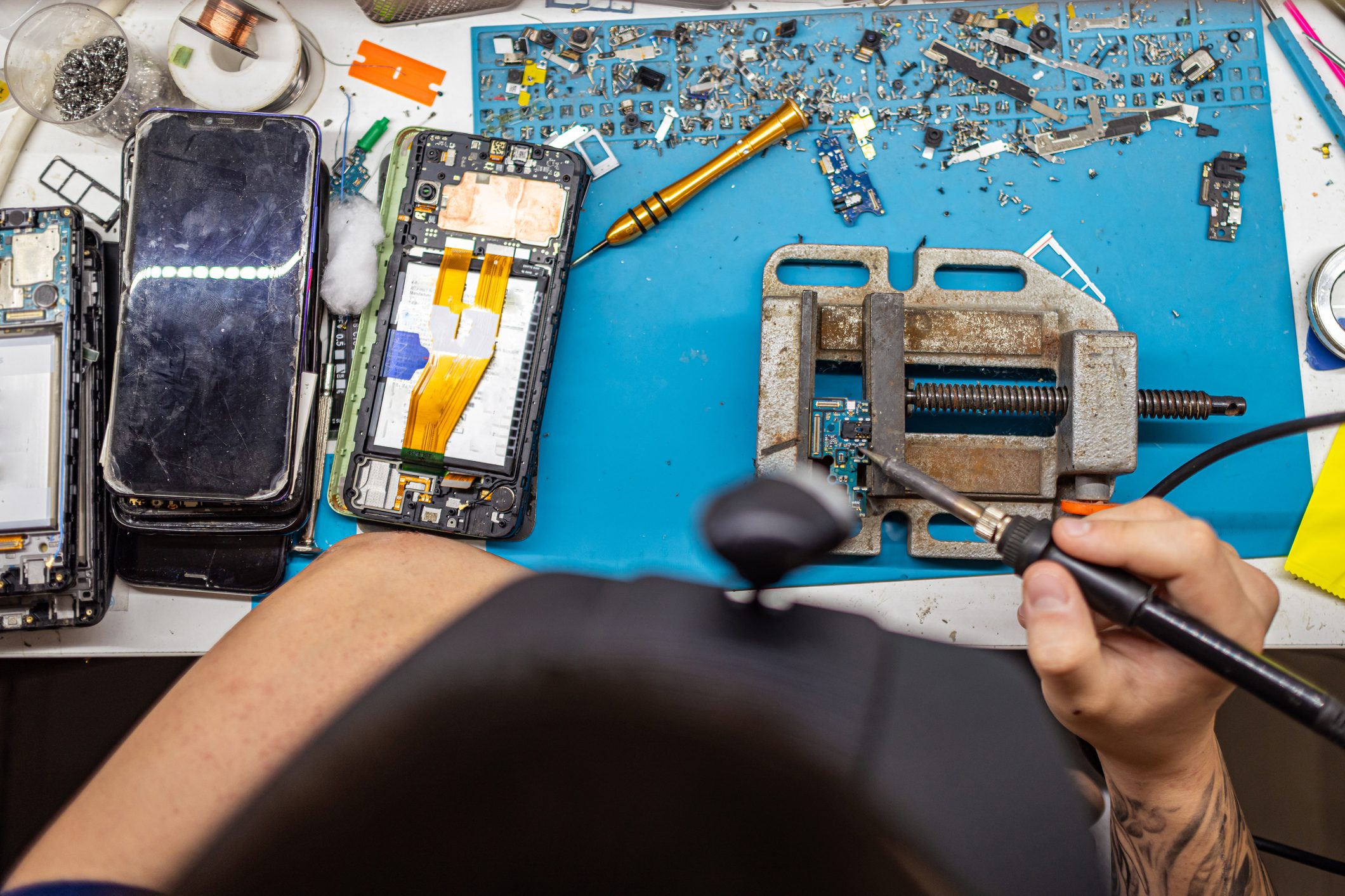 Phone repair workspace with tools